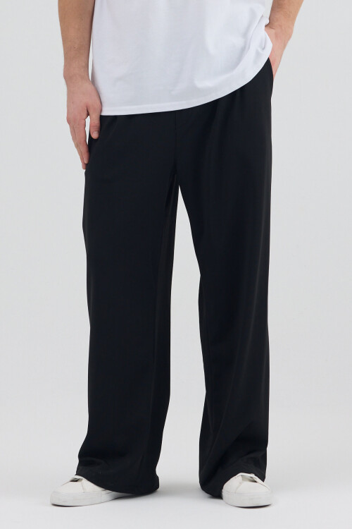 Siyah Dalgıç Kumaş Şardonlu Önü Pile ve Cep Detaylı Rahat Kesim Baggy Pantolon