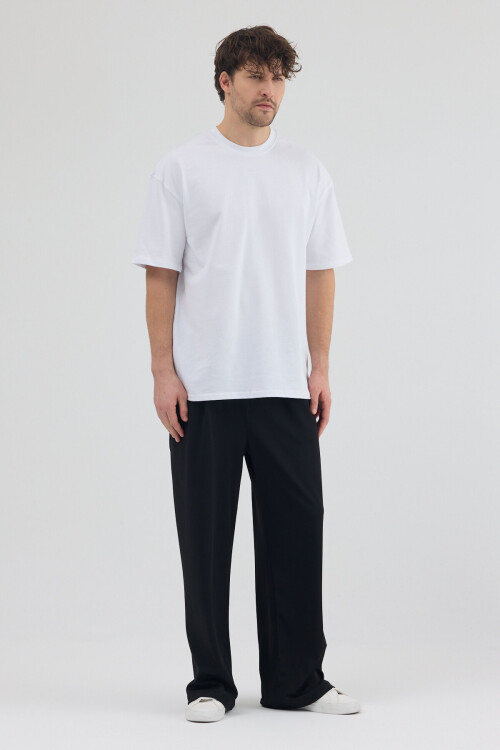 Siyah Dalgıç Kumaş Şardonlu Önü Pile ve Cep Detaylı Rahat Kesim Baggy Pantolon